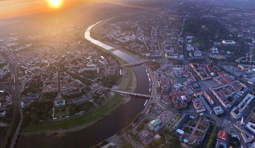 High angle view of illuminated street amidst buildings in city