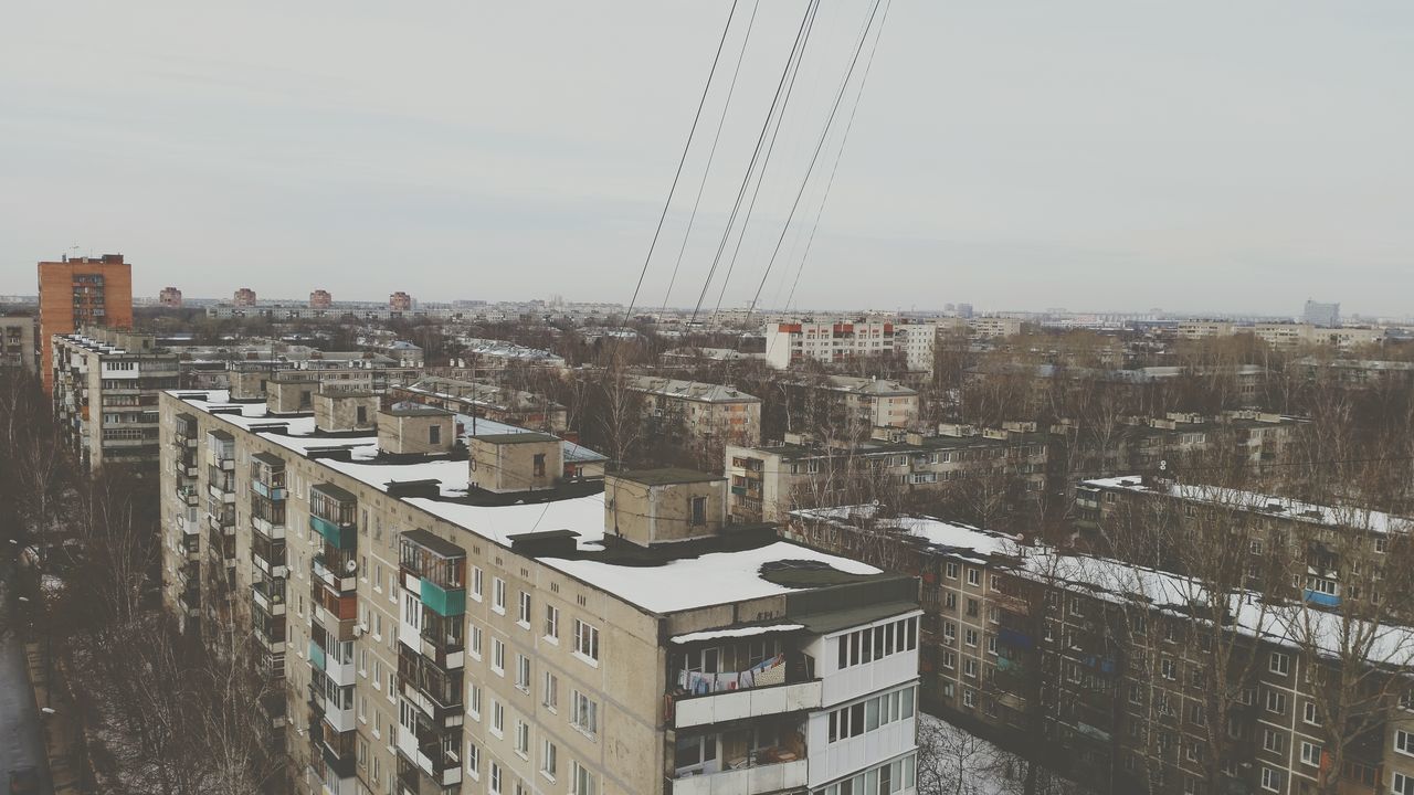 building exterior, architecture, built structure, cityscape, city, residential district, crowded, residential structure, residential building, high angle view, sky, building, day, outdoors, house, city life, no people, tower, roof, clear sky