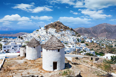 Townscape and mountain against sky