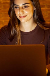 Young woman using laptop