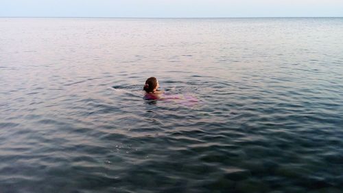 Man swimming in sea