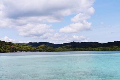 Scenic view of sea against cloudy sky
