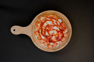 High angle view of breakfast on table against black background