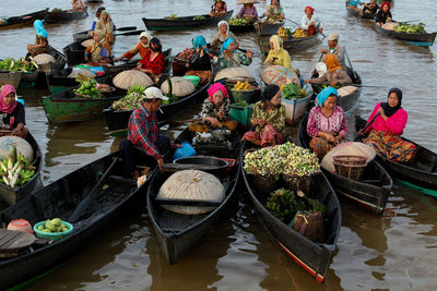 High angle view of people on boat in river