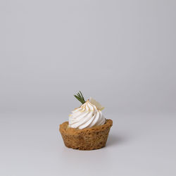 Close-up of cake against white background