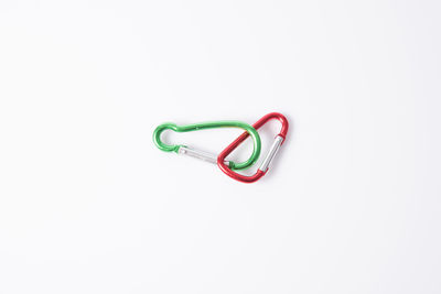 High angle view of eyeglasses on metal over white background