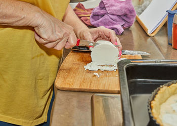 Midsection of man preparing food