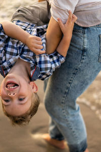 Portrait of siblings sitting outdoors