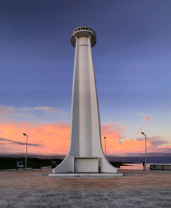 Low angle view of tower against sky during sunset