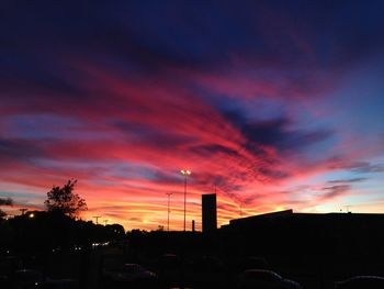Low angle view of silhouette city against sky during sunset
