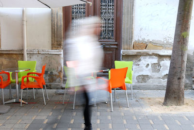 Blurred motion of people walking in building