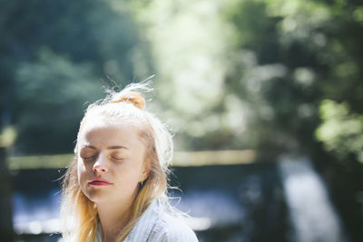 Portrait of young woman outdoors