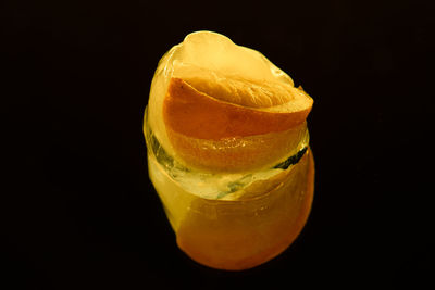 Close-up of orange juice against black background