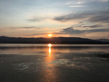 Scenic view of lake against sky during sunset