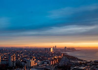 High angle view of city against sky during sunset