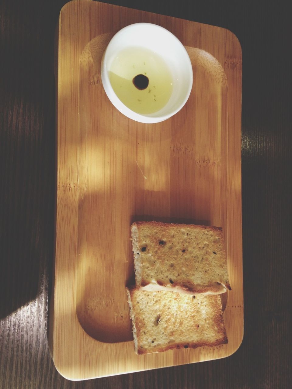 indoors, food and drink, table, food, still life, wood - material, freshness, plate, directly above, high angle view, bread, wooden, healthy eating, breakfast, ready-to-eat, wood, no people, cutting board, coffee cup, close-up