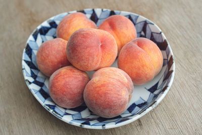 High angle view of apples in bowl on table