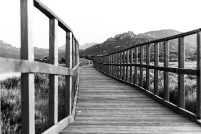 Footbridge leading towards mountains