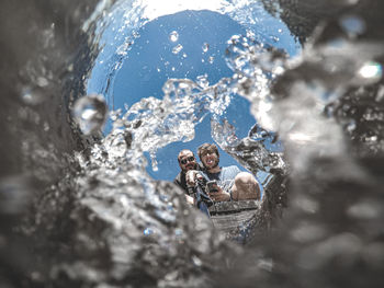 High angle view of two people in water