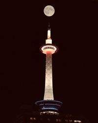 Low angle view of illuminated building at night