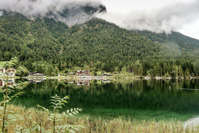 Scenic view of lake and mountains against sky