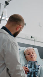 Side view of doctor examining patient