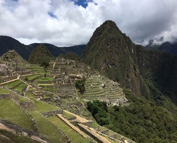 Aerial view of mountain against cloudy sky