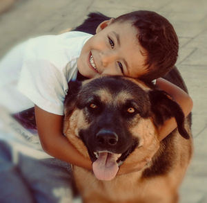 Portrait of boy with dog