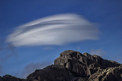 Low angle view of rocks against sky