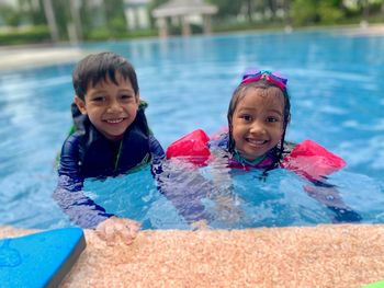 Portrait of happy boy in swimming pool