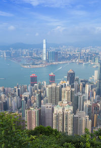 Aerial view of city and buildings against sky