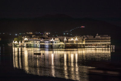 View of illuminated buildings at waterfront