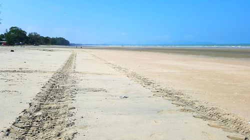 Scenic view of beach against clear sky