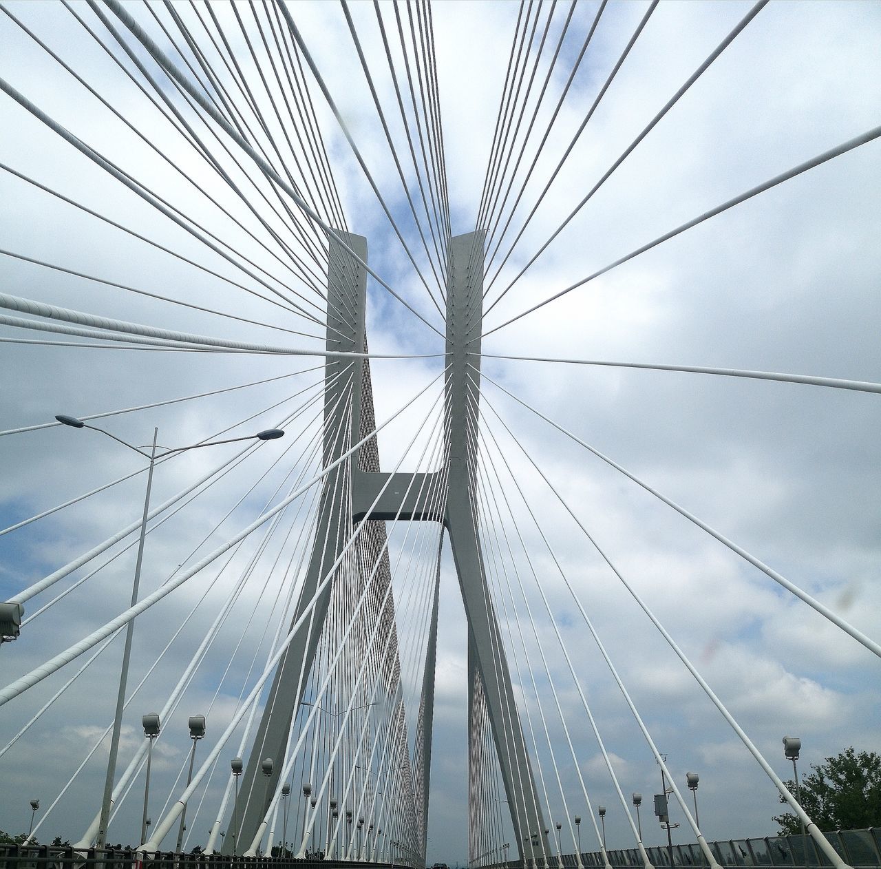 bridge, bridge - man made structure, sky, connection, built structure, suspension bridge, engineering, transportation, architecture, low angle view, cloud - sky, day, nature, travel destinations, cable-stayed bridge, cable, travel, tourism, steel cable, outdoors