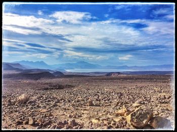 Scenic view of landscape against cloudy sky