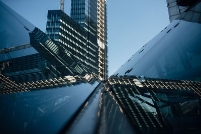 Low angle view of modern buildings against clear sky