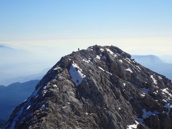 Scenic view of snowcapped mountains against clear sky