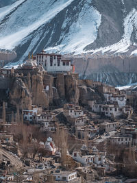 Aerial view of townscape against mountain