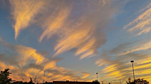 Low angle view of dramatic sky during sunset