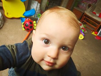 Close-up portrait of cute baby at home