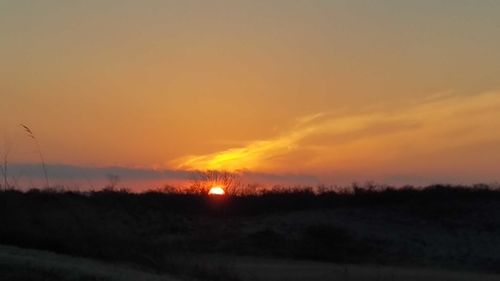 Scenic view of silhouette landscape against sky during sunset