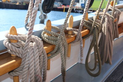 Ropes tied on boat during sunny day