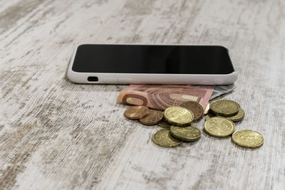 High angle view of coins on table