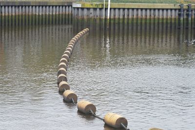 High angle view of buoys arranged on river