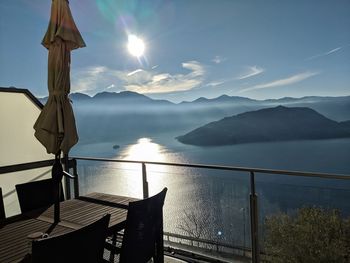 Scenic view of sea and mountains against sky