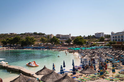 Panoramic view of buildings and sea against clear sky