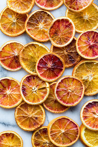 Top down view of various dried spiced orange slices.