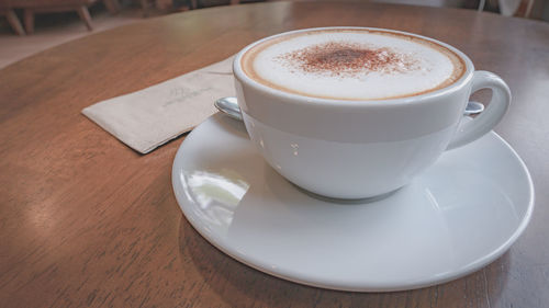 High angle view of coffee cup on table