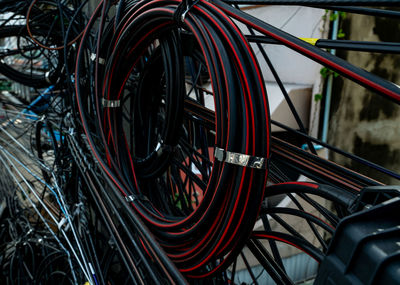 Tangled electrical wires on urban electric pole. disorganized and messy to organization management.