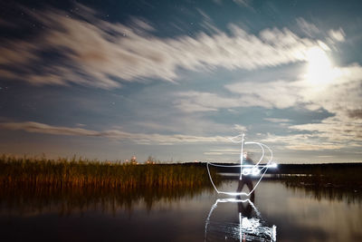 Scenic view of lake against sky during sunset